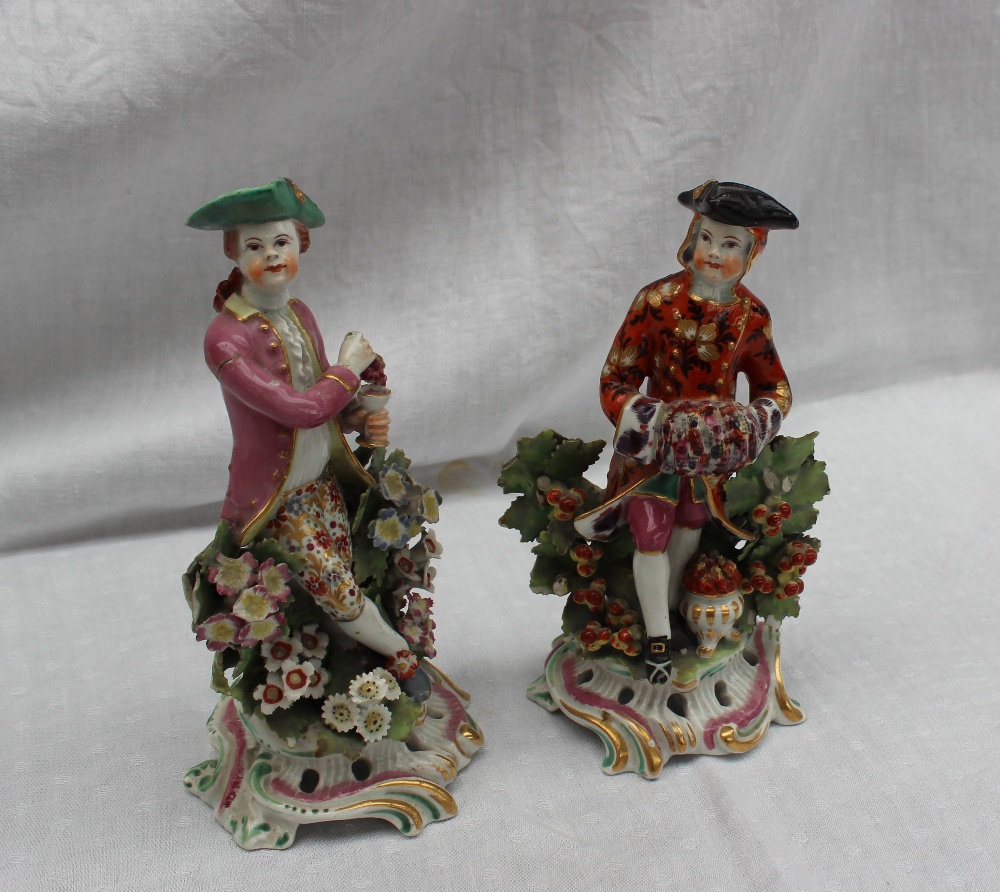 A pair of 18th century porcelain figures, possibly Bow, the one squeezing grapes into a chalice, - Image 2 of 6