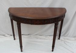 A 20th century mahogany 'D' shaped table,