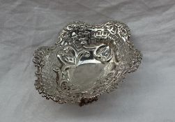 A late Victorian silver pedestal bon bon dish, with a leaf cast and pierced edge,