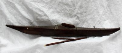 A 19th century Inuit hide and wooden model kayak,