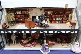 Dolls House - A long house, the hinged slate roof opening to reveal a library with bookcases,