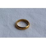 A 22ct yellow gold wedding band, size I, approximately 3.