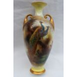 A Royal Worcester Hadley ware porcelain twin handled vase, with a flared neck,