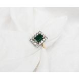 An emerald and diamond dress ring,