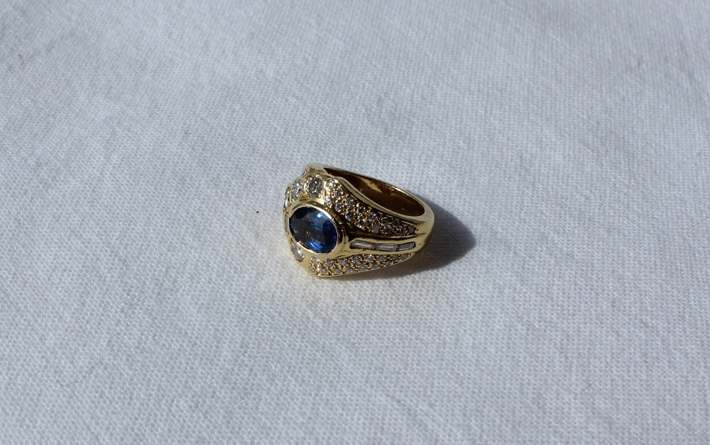 A sapphire and diamond ring, the central oval sapphire approximately 9mm x 6mm, - Image 2 of 9