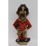 A John Hughes pottery Grogg titled "David the Dash" in a red Welsh jersey with No.