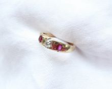 A ruby and diamond line ring,