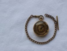 A yellow metal keyless wound fob watch, with a yellow metal dial with Roman numerals,