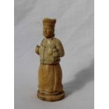 A late 19th century ivory figural container, in the form of a female figure holding a cloth and orb,