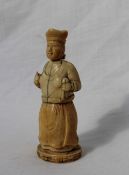 A late 19th century ivory figural container, in the form of a female figure holding a cloth and orb,