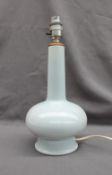 Keith Murray for Wedgwood - a baluster table lamp in a pale blue glaze,