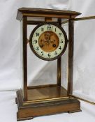 A 19th brass four glass mantle clock, with floral etched glass panels,