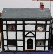 Dolls House - "Fair Holme" a tudor style house, with a slate roof and four rooms, bedroom, bathroom,