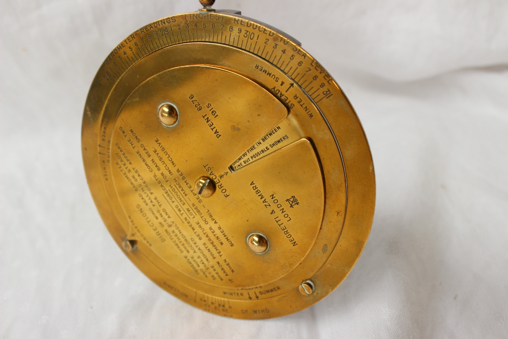 A Negretti and Zambra desk top brass barometer dial with a fixed outer rim for Barometer readings, - Image 4 of 5
