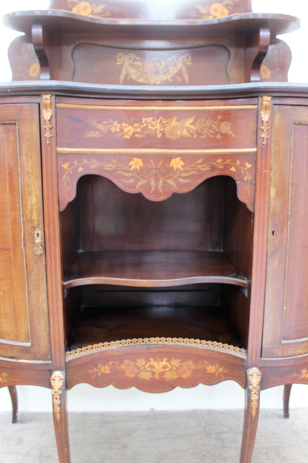 A 19th century mahogany chiffonier, the shield shaped upstand with a central mirror and shelf, - Image 2 of 3