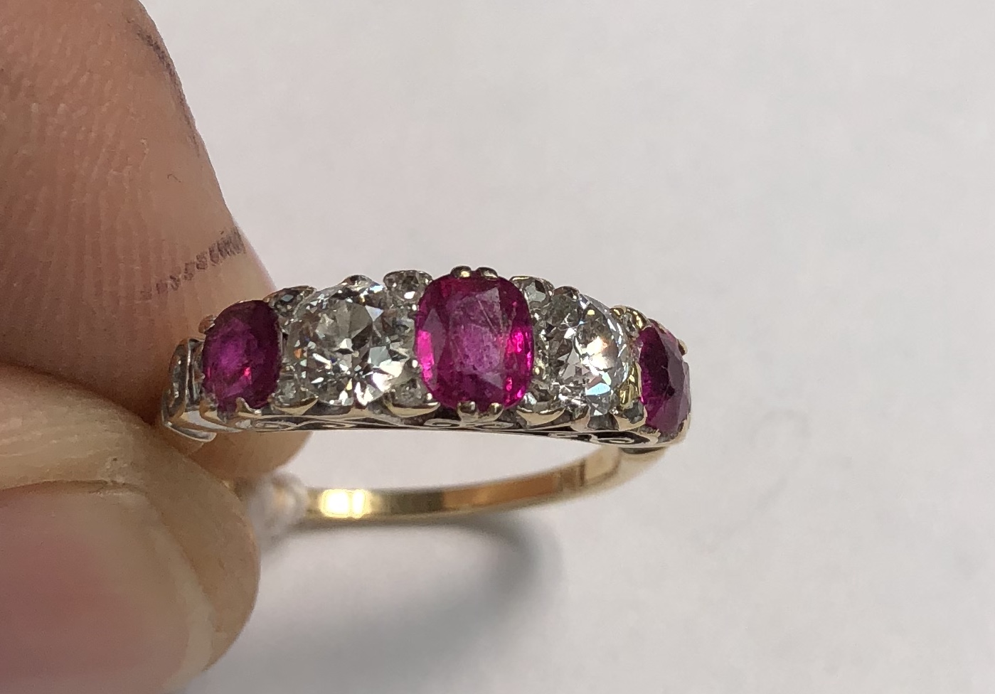 A ruby and diamond line ring, set with three rubies and two round old cut diamonds, - Bild 5 aus 9