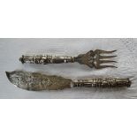 A pair of Victorian silver fish servers, with a pierced blade and cast handles, Birmingham, 1869,