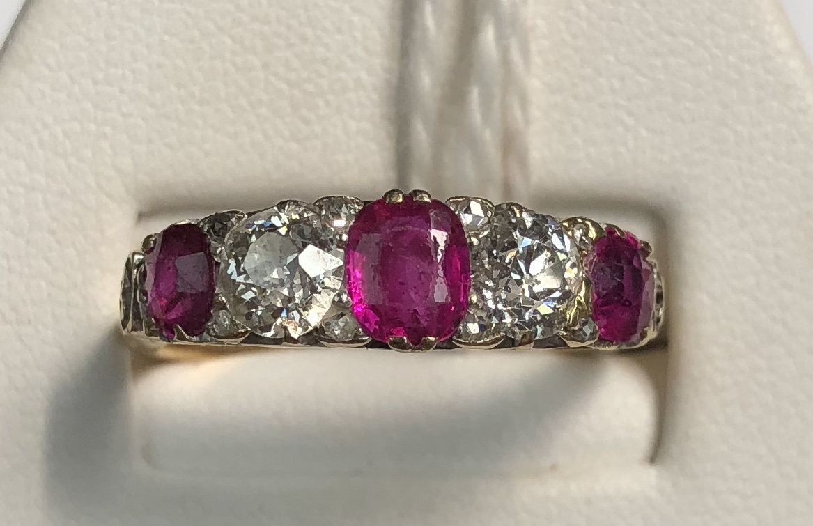 A ruby and diamond line ring, set with three rubies and two round old cut diamonds, - Bild 9 aus 9