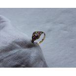 A late 18th / early 19th century 12ct gold ruby and pearl set ring,