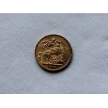 A George V gold sovereign,