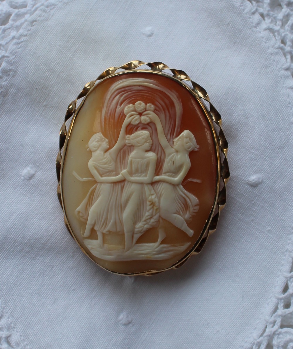 A shell cameo brooch, depicting the three graces, to a yellow metal setting, - Image 2 of 3