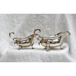 A graduated pair of Edward VII silver sauce boats,