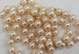 A long string of seventy regular pearls,