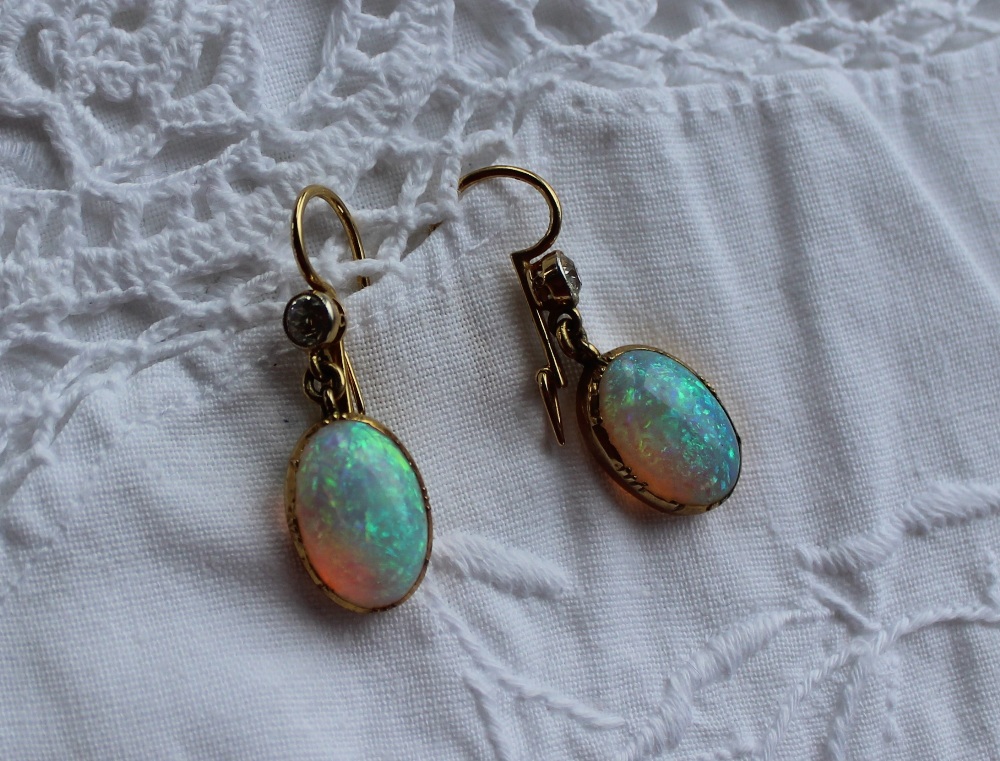 A pair of opal and diamond drop earrings,