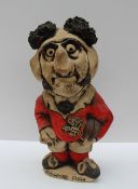 A John Hughes pottery Grogg titled "Pushover Pugh", in a red Welsh jersey with the No.