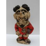 A John Hughes pottery Grogg titled "Pushover Pugh", in a red Welsh jersey with the No.