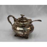 A George IV silver mustard pot and cover the domed cover with a floral finial,