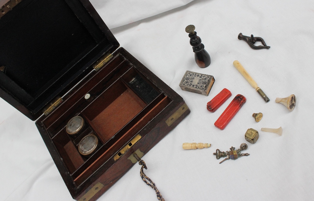 A Victorian rosewood travelling seal box, of rectangular form with brass corners,