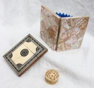 A mother of pearl note case together with an inlaid ivory card case and a carved ivory pill box