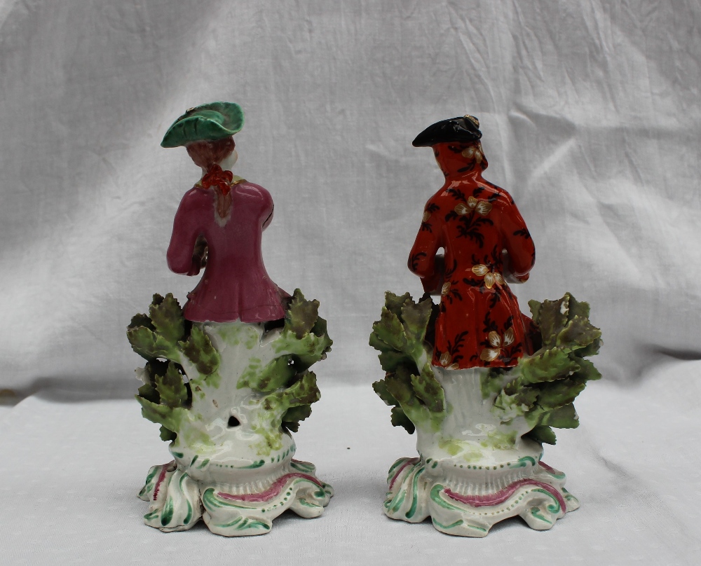 A pair of 18th century porcelain figures, possibly Bow, the one squeezing grapes into a chalice, - Image 6 of 6