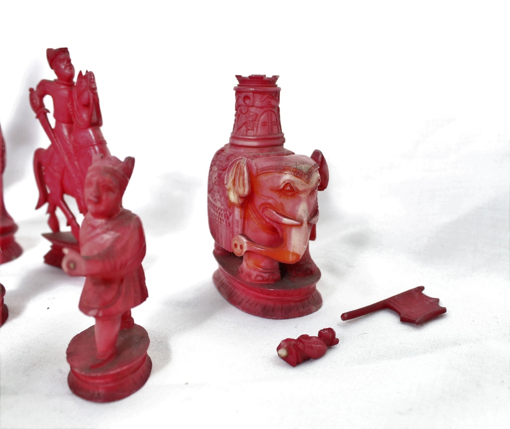 A 19th century Chinese carved ivory chess set, natural and stained red, - Image 4 of 8