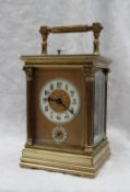 A 19th century French brass carriage clock, with corinthian columns,