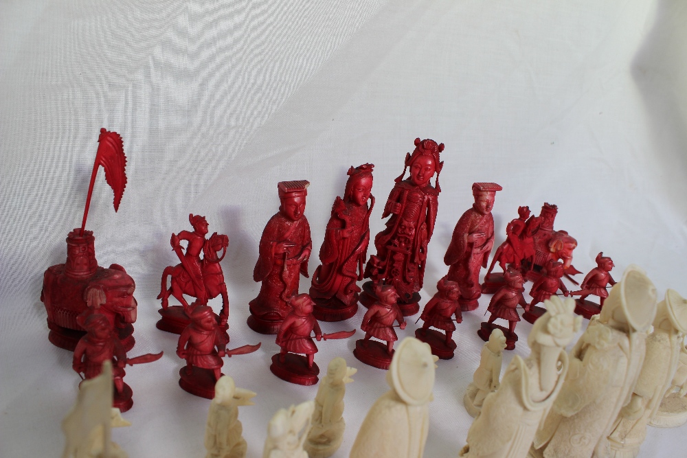 A 19th century Chinese carved ivory chess set, natural and stained red, - Image 6 of 8