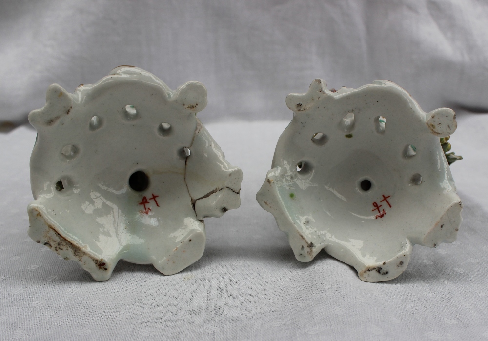 A pair of 18th century porcelain figures, possibly Bow, the one squeezing grapes into a chalice, - Image 5 of 6