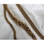 A 9ct yellow gold rope twist necklace 46cm long together with a 9ct gold three strand necklace and