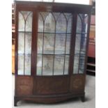 A 20th century mahogany display cabinet on bracket feet