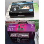 A collection of new and used boxed appliances including a Tefal Actifry together with cordless