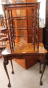 A reproduction walnut card table on leaf carved cabriole legs together with a nest of two rosewood
