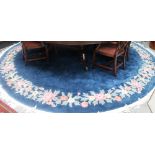 A large circular blue ground Chinese carpet
