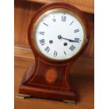 A 20th century mahogany balloon shaped mantle clock, the enamel dial with Roman numerals,