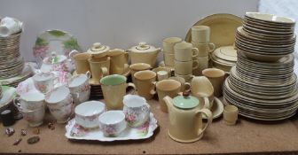 A large Poole pottery part tea and dinner service together with a Royal Albert Blossom Time part