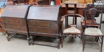 Two oak bureaus together with an Edwardian mahogany torchère, a horseshoe shaped chair,