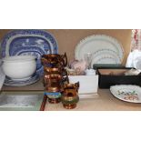 A collection of copper lustre jugs together with blue and white meat plates, part tea set,