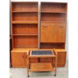 A pair of G Plan teak wall units together with a trolley