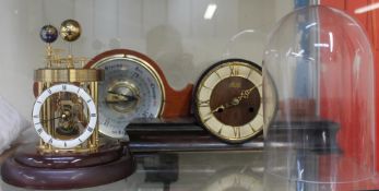 A Frank Hermle Astrolabium 2000 celestial clock, under a glass dome,