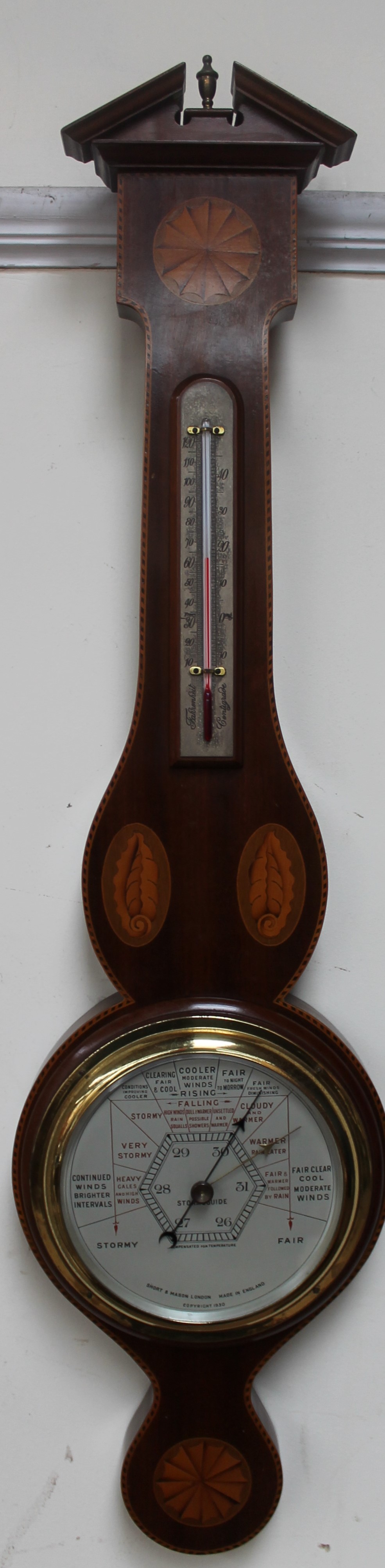 A banjo aneroid barometer with an architectural pediment alcohol thermometer,